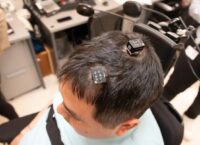 AI-enabled brain implant helps patient regain feeling and movement to a paralyzed patient